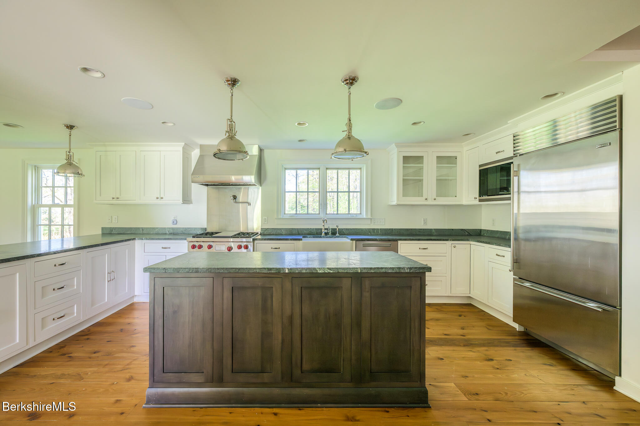 304 Hickey Hill Road Sheffield, MA 01257 - Photo 15 of 60 a kitchen with kitchen island granite countertop a stove and a wooden floors