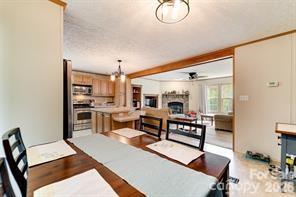 179 Fresh Water Rdg Road Whittier, NC 28789 - Photo 20 of 48 a living room with furniture a rug and kitchen view