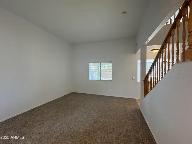 wooden floor in an empty room with stairs