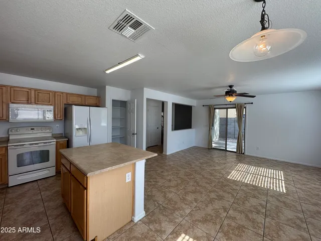 a kitchen with a stove and a sink