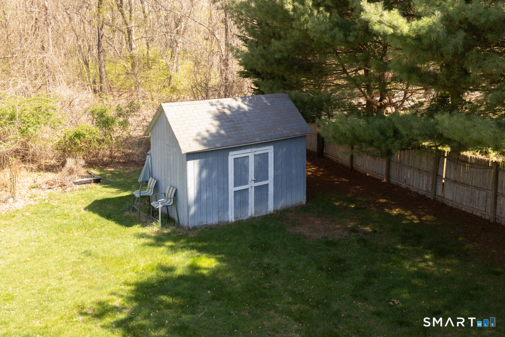 49 River Street Old Saybrook, CT 06475 - Photo 23 of 28 a view of a house with backyard and garden