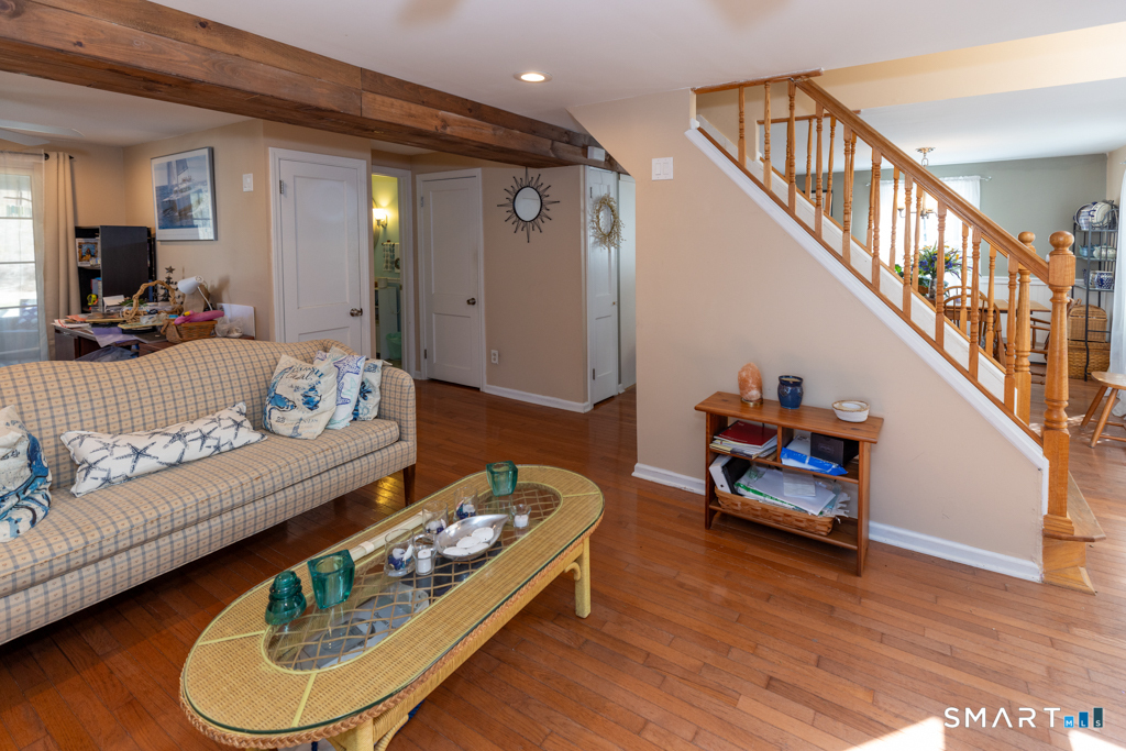 49 River Street Old Saybrook, CT 06475 - Photo 25 of 28 a living room with furniture and wooden floor