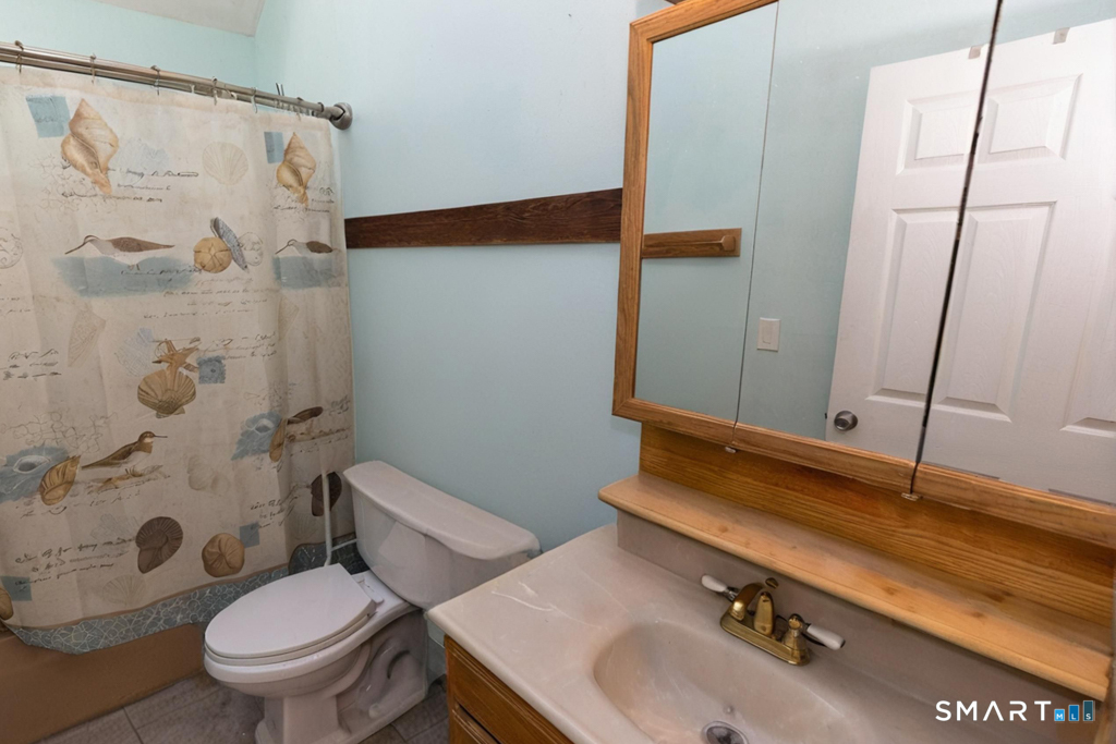 49 River Street Old Saybrook, CT 06475 - Photo 26 of 28 a bathroom with a sink toilet and shower