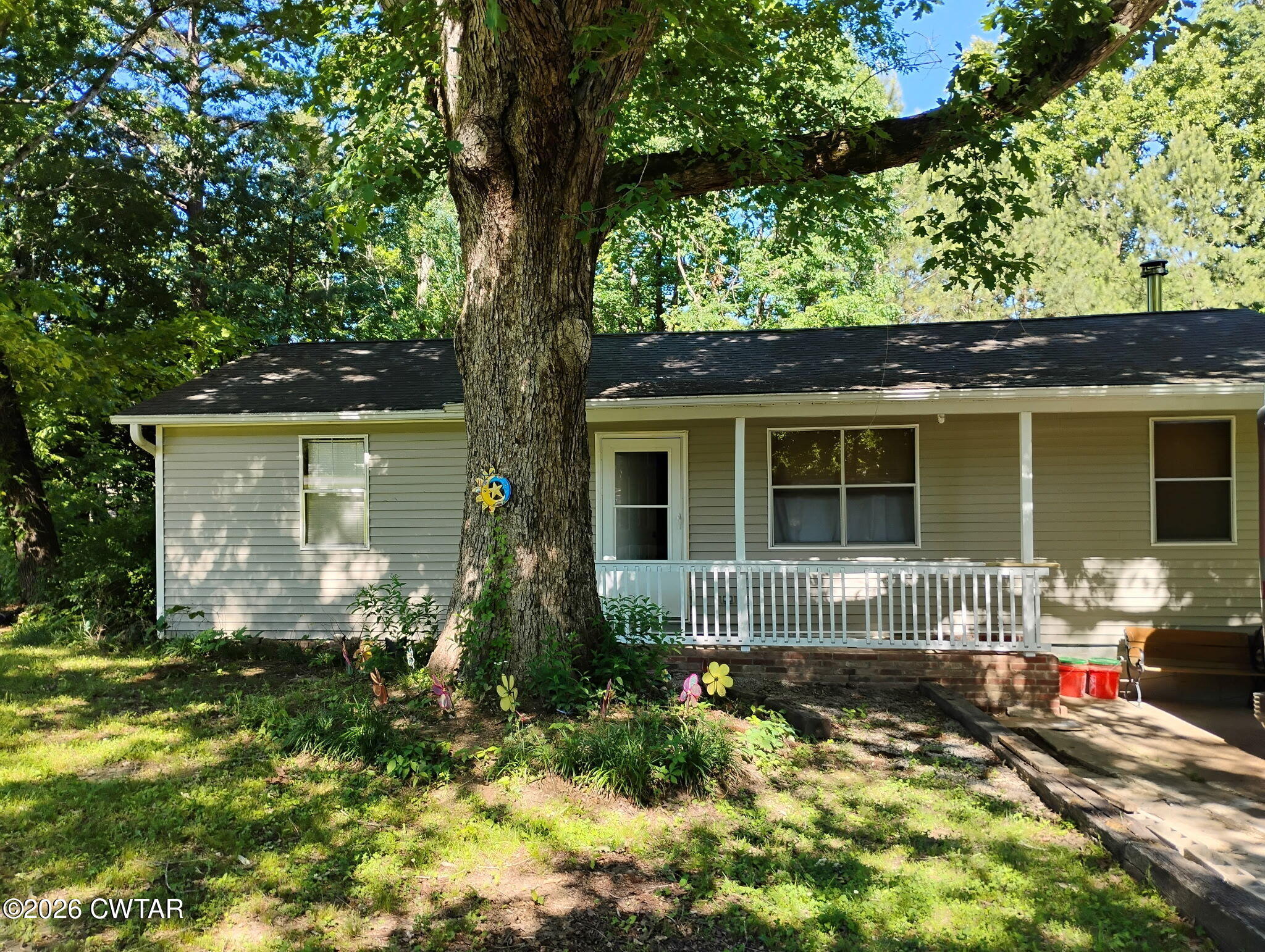 195 Ridge Road Medina, TN 38355 - Photo 11 of 14 front view of a house with a yard
