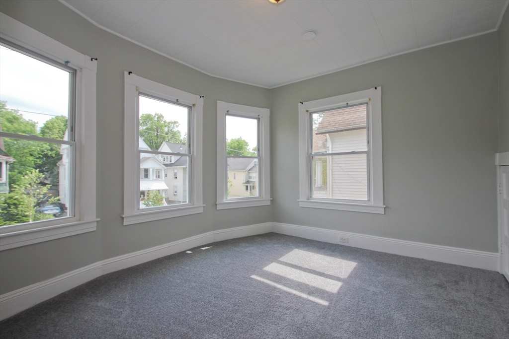 38 Virginia Street Springfield, MA 01108 - Photo 17 of 42 a view of an empty room with a window