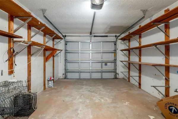 a view of kitchen with stainless steel appliances refrigerator stove microwave and cabinets