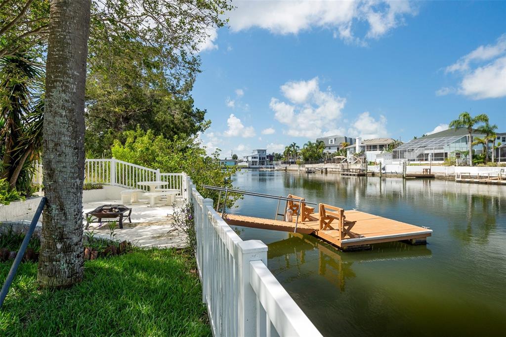 4315 Flexer Drive Hernando Beach, FL 34607 - Photo 2 of 48 a view of a lake with houses in the back