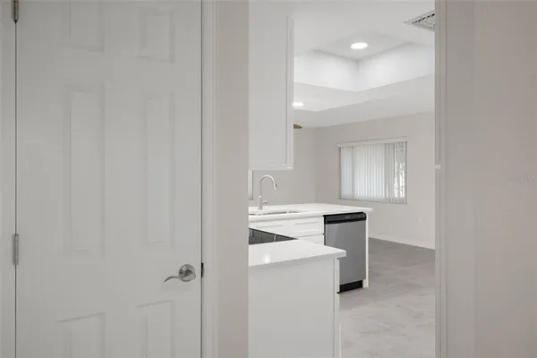 a view of an empty room with a window