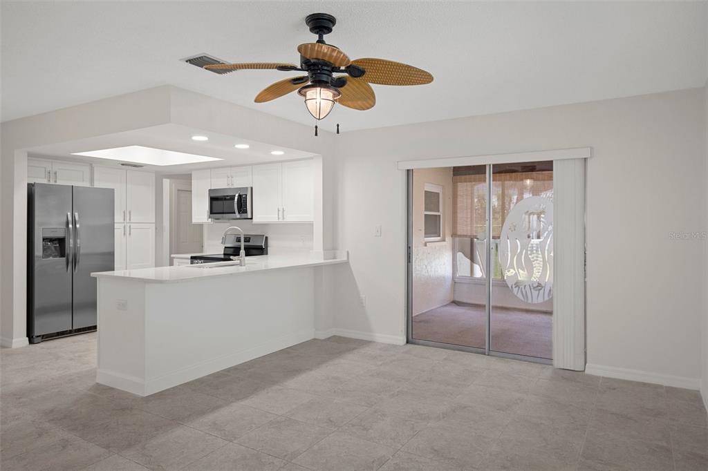 4315 Flexer Drive Hernando Beach, FL 34607 - Photo 33 of 48 a view of kitchen with refrigerator and window