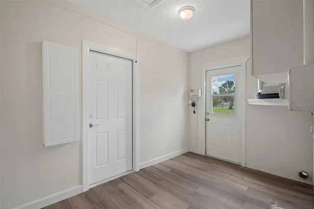 a view of an empty room with a staircase