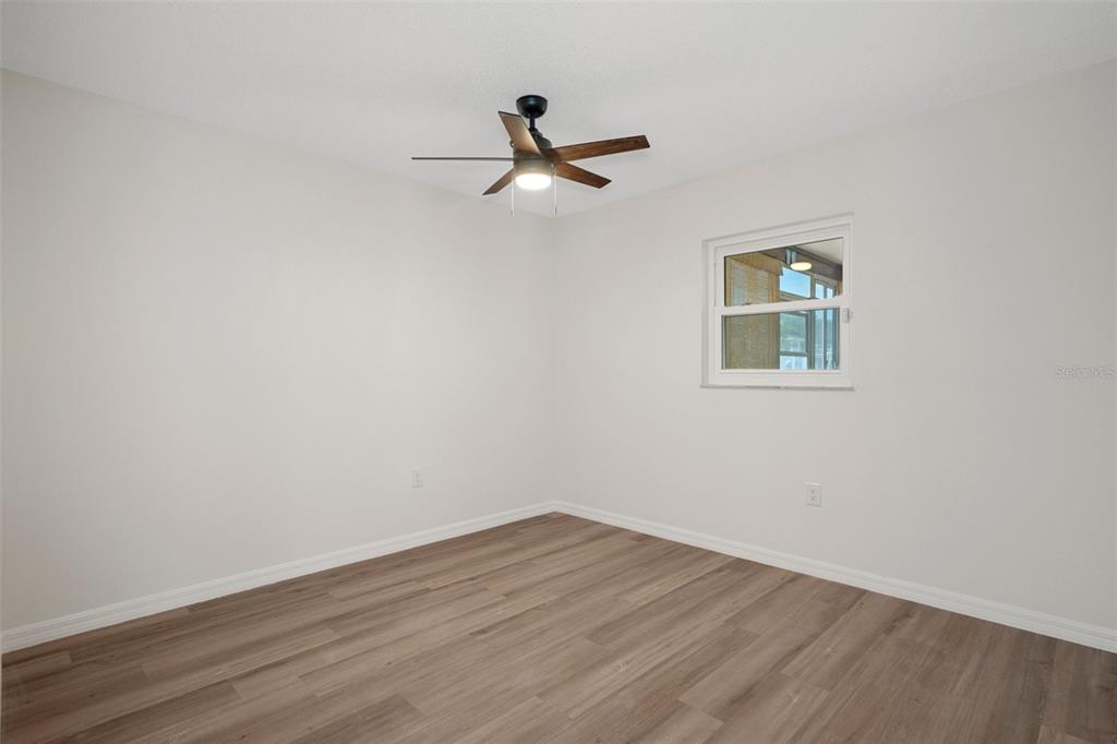 4315 Flexer Drive Hernando Beach, FL 34607 - Photo 39 of 48 a view of empty room with wooden floor