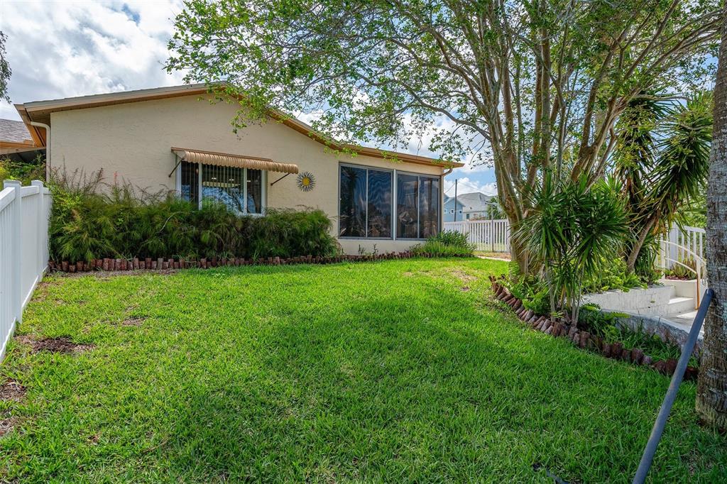 4315 Flexer Drive Hernando Beach, FL 34607 - Photo 45 of 48 a front view of house with yard and green space