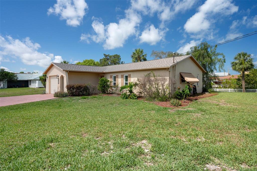 4315 Flexer Drive Hernando Beach, FL 34607 - Photo 48 of 48 a front view of a house with garden