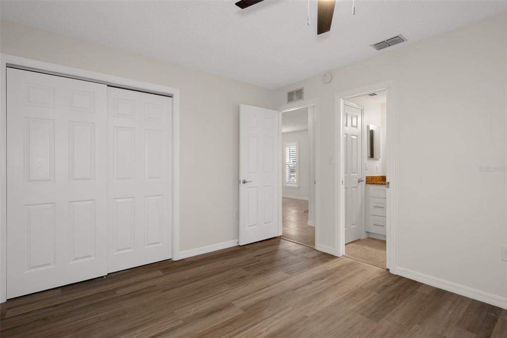 4315 Flexer Drive Hernando Beach, FL 34607 - Photo 7 of 48 a view of an empty room with wooden floor