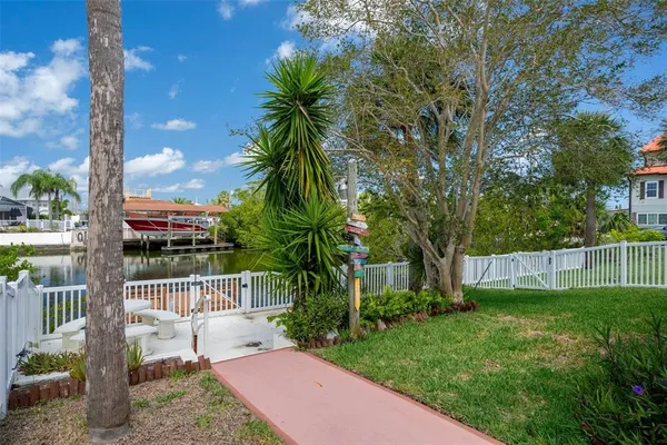 a view of a backyard with a garden and plants