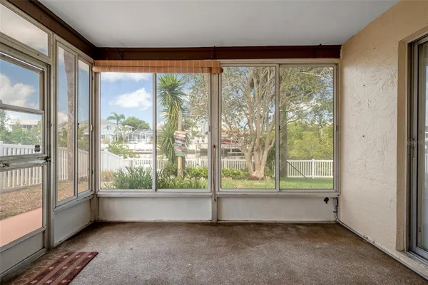 a view of room with window and a floor to ceiling window