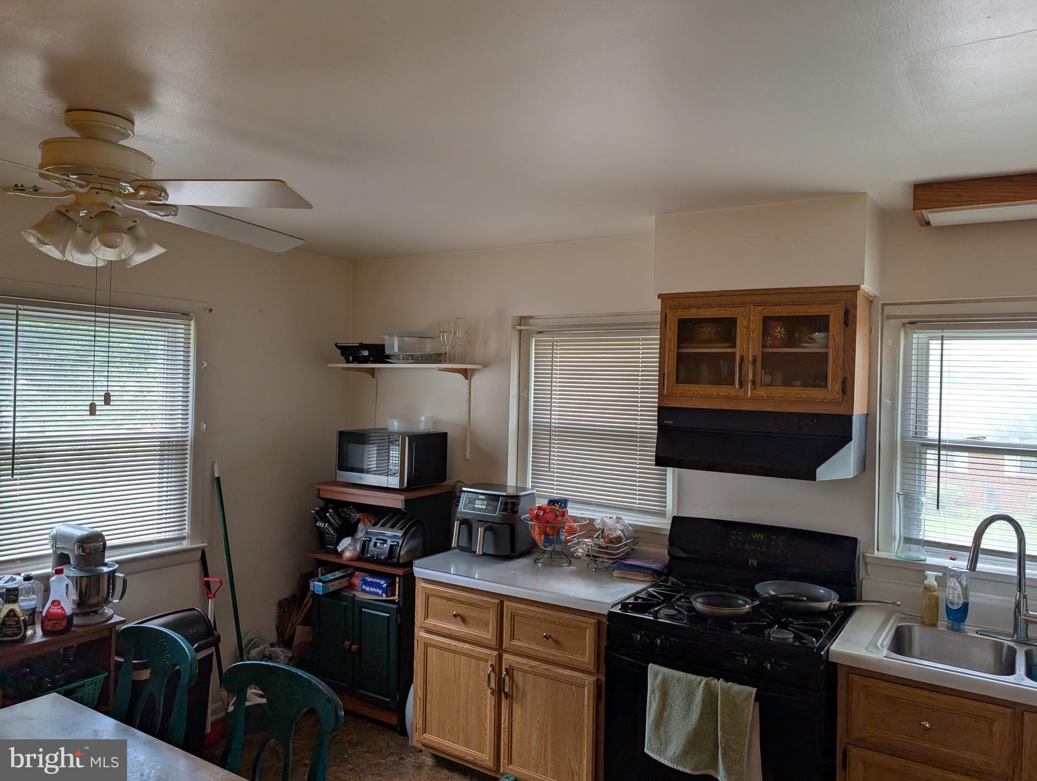 121 69th Street Capitol Heights, MD 20743 - Photo 5 of 11 a kitchen with stainless steel appliances granite countertop a sink stove and cabinets