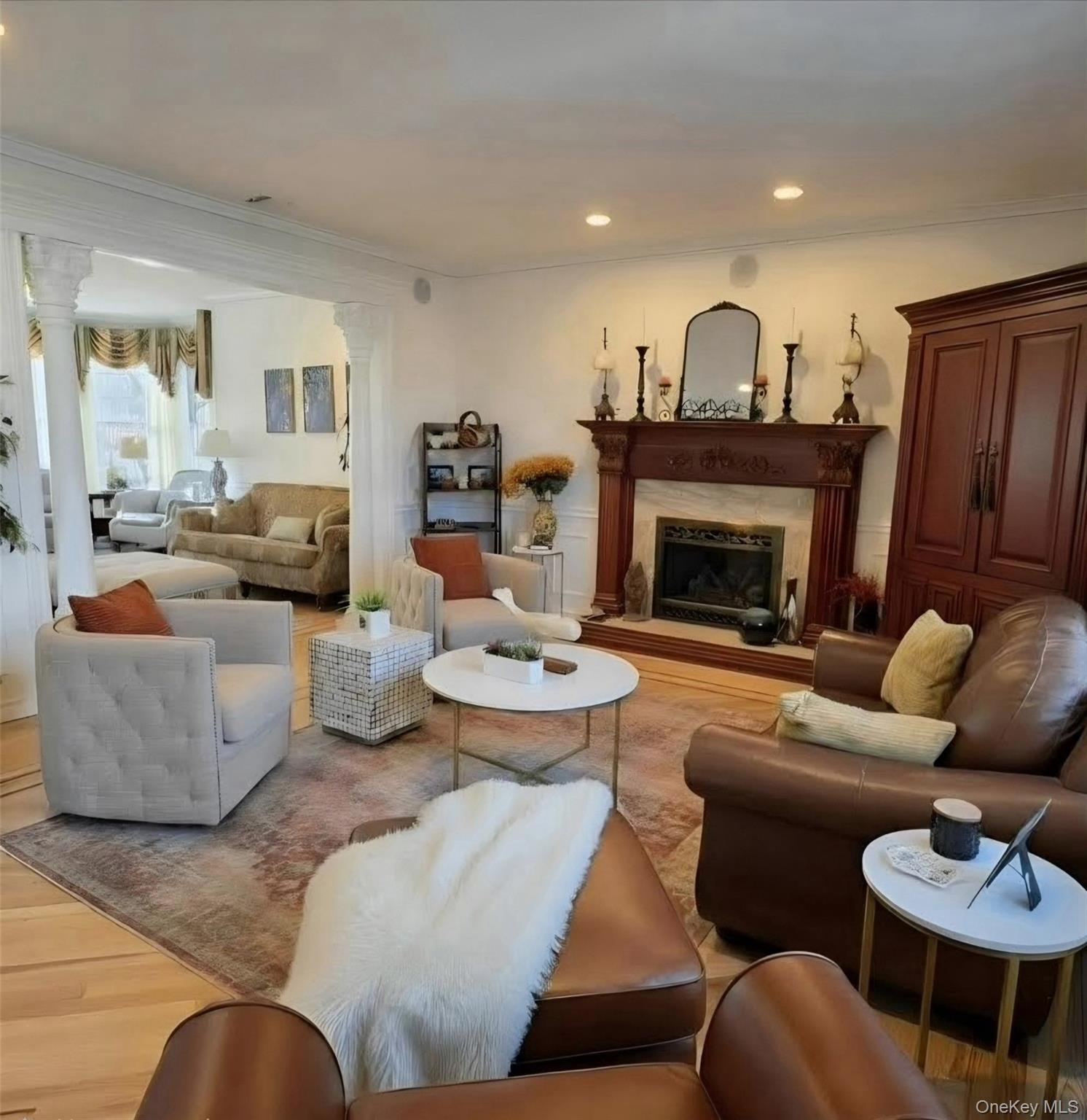 185 West Islip Road West Islip, NY 11795 - Photo 22 of 50 Expansive Family Room with impressive custom gas Fireplace and amazing sunny view of backyard