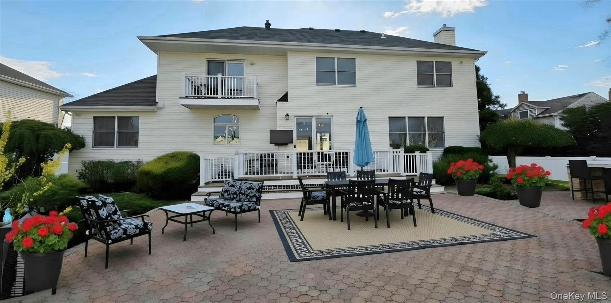 185 West Islip Road West Islip, NY 11795 - Photo 42 of 50 Dreamlike RESORT BACKYARD offering perfectly situated back deck, patio, pool, waterfall, cabana, gazebo, storage sheds, mature plantings, all with surprisingly optimal privacy!