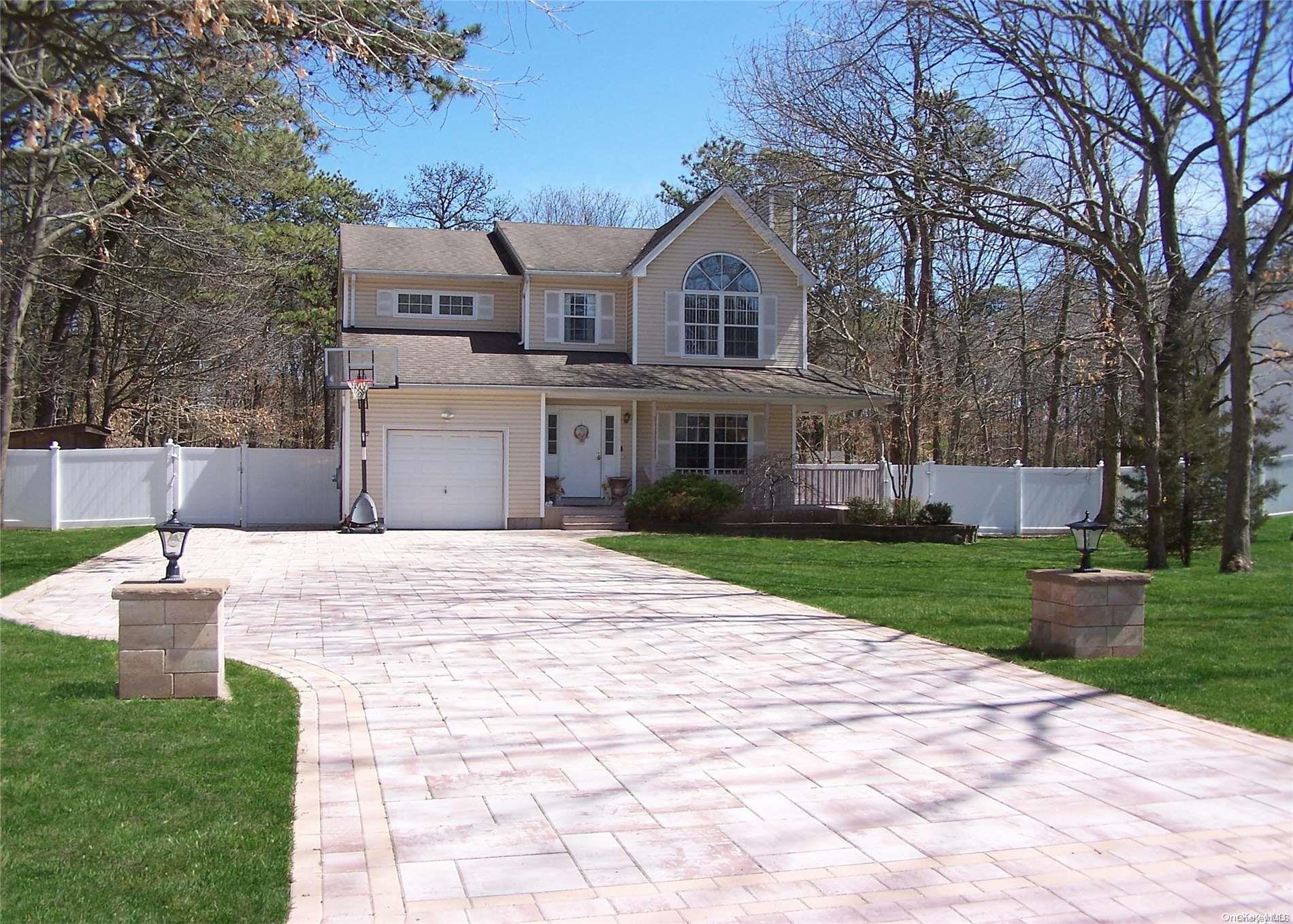139 North Coleman Road Centereach, NY 11720 - Photo 1 of 1 a front view of a house with a yard and trees