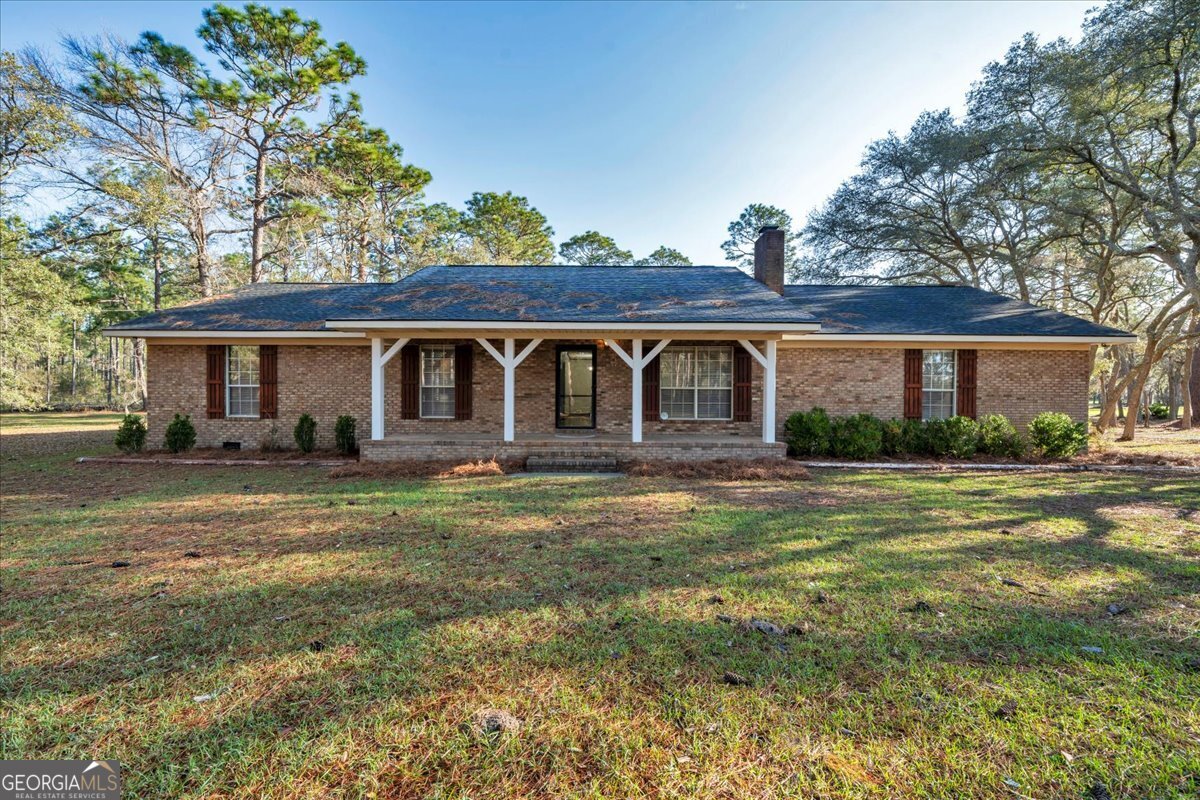 6501 Harley Trail Blackshear, GA 31516 - Photo 1 of 69 a front view of a house with a yard