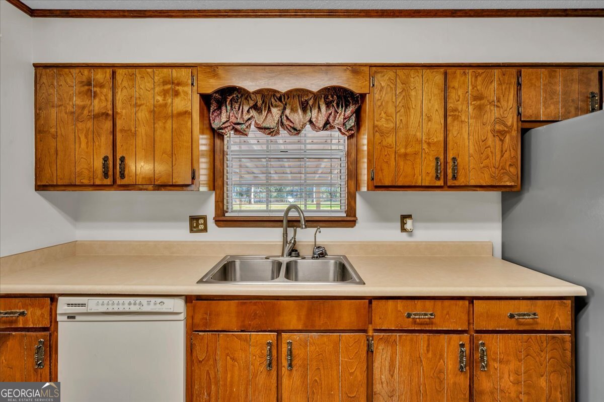 6501 Harley Trail Blackshear, GA 31516 - Photo 19 of 69 a kitchen with a sink and a window