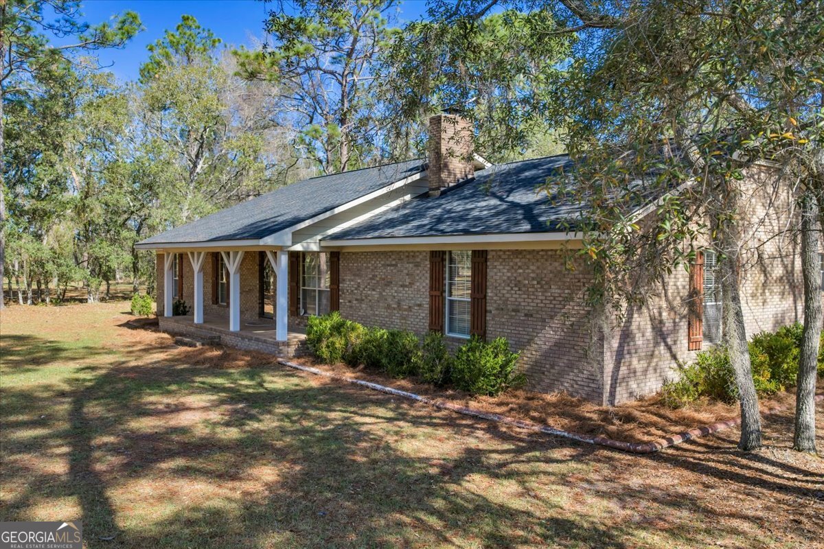 6501 Harley Trail Blackshear, GA 31516 - Photo 2 of 69 a view of a house with a tree in front