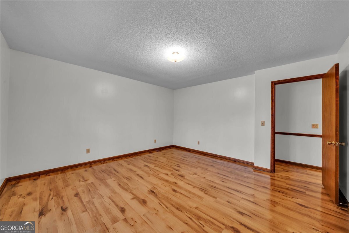 6501 Harley Trail Blackshear, GA 31516 - Photo 25 of 69 a view of empty room with wooden floor