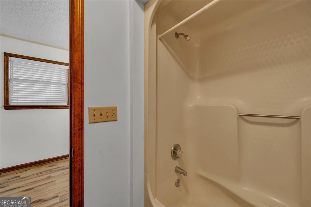 6501 Harley Trail Blackshear, GA 31516 - Photo 28 of 69 a bathroom with a bathtub and a shower