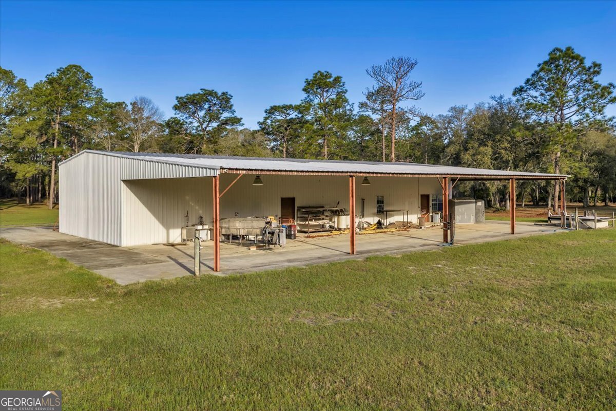 6501 Harley Trail Blackshear, GA 31516 - Photo 33 of 69 a view of a swimming pool with a patio