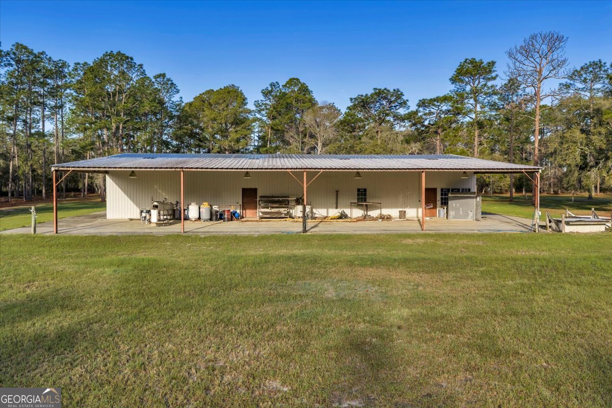 6501 Harley Trail Blackshear, GA 31516 - Photo 34 of 69 a view of a house with pool and chairs