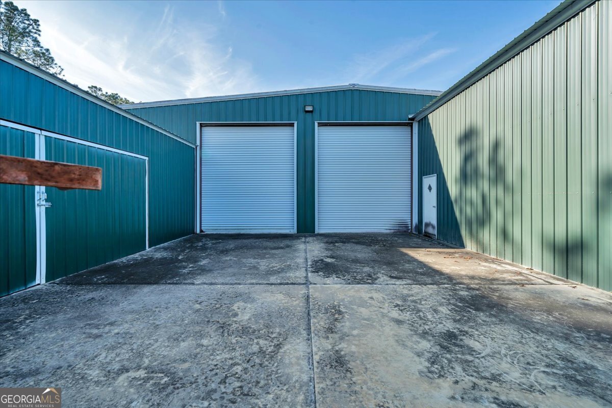 6501 Harley Trail Blackshear, GA 31516 - Photo 46 of 69 a view of backyard with garage