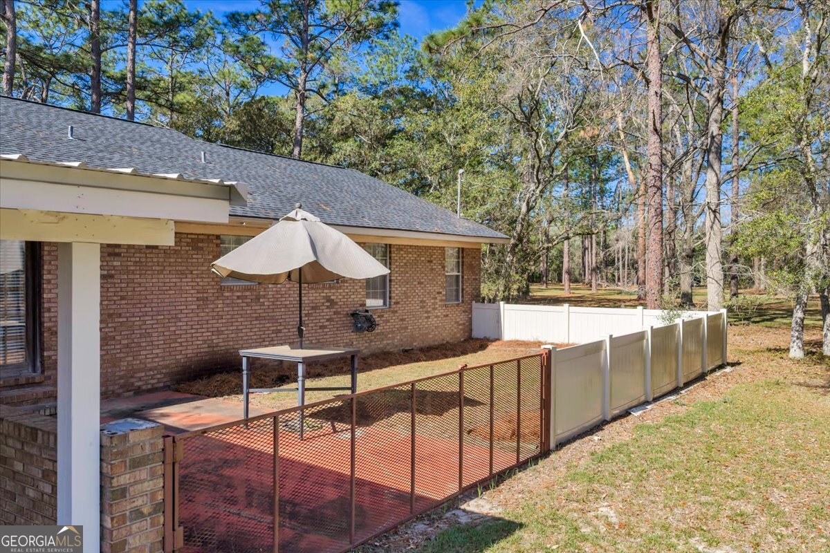 6501 Harley Trail Blackshear, GA 31516 - Photo 6 of 69 a view of a backyard with a large tree