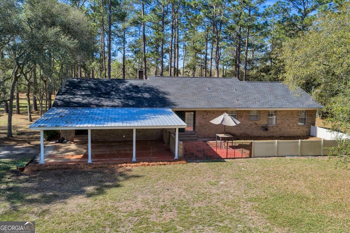 6501 Harley Trail Blackshear, GA 31516 - Photo 7 of 69 a front view of a house with a yard