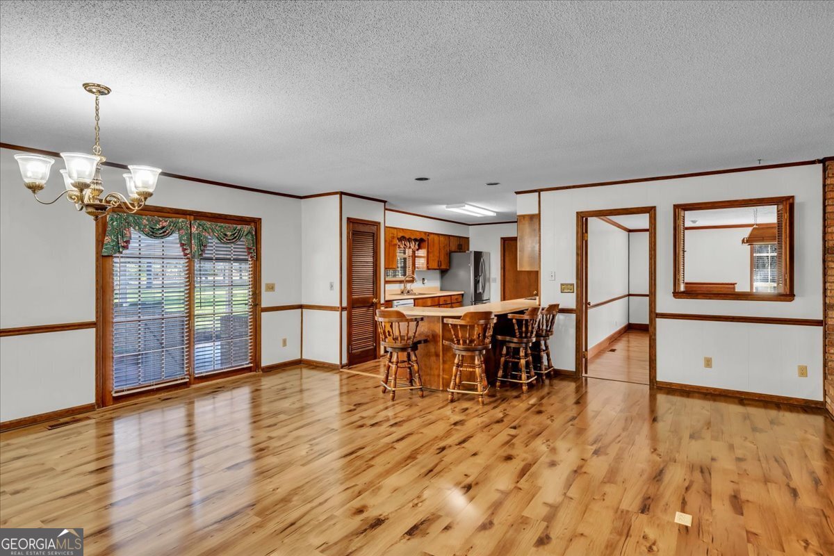 6501 Harley Trail Blackshear, GA 31516 - Photo 10 of 69 a view of a dining room with furniture window and wooden floor