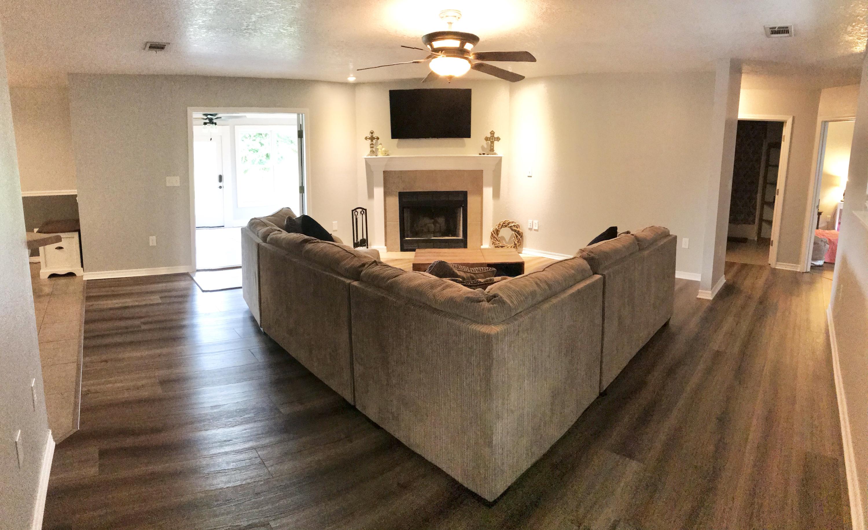 6593 Old River Road Baker, FL 32531 - Photo 11 of 23 a living room with furniture and a fireplace