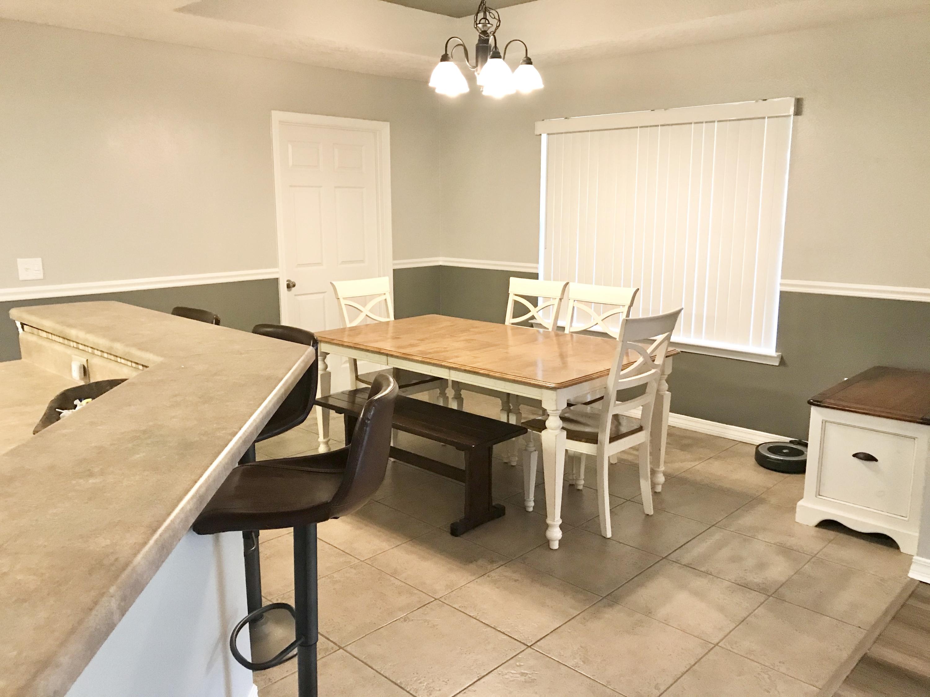 6593 Old River Road Baker, FL 32531 - Photo 17 of 23 a view of a dining room with furniture