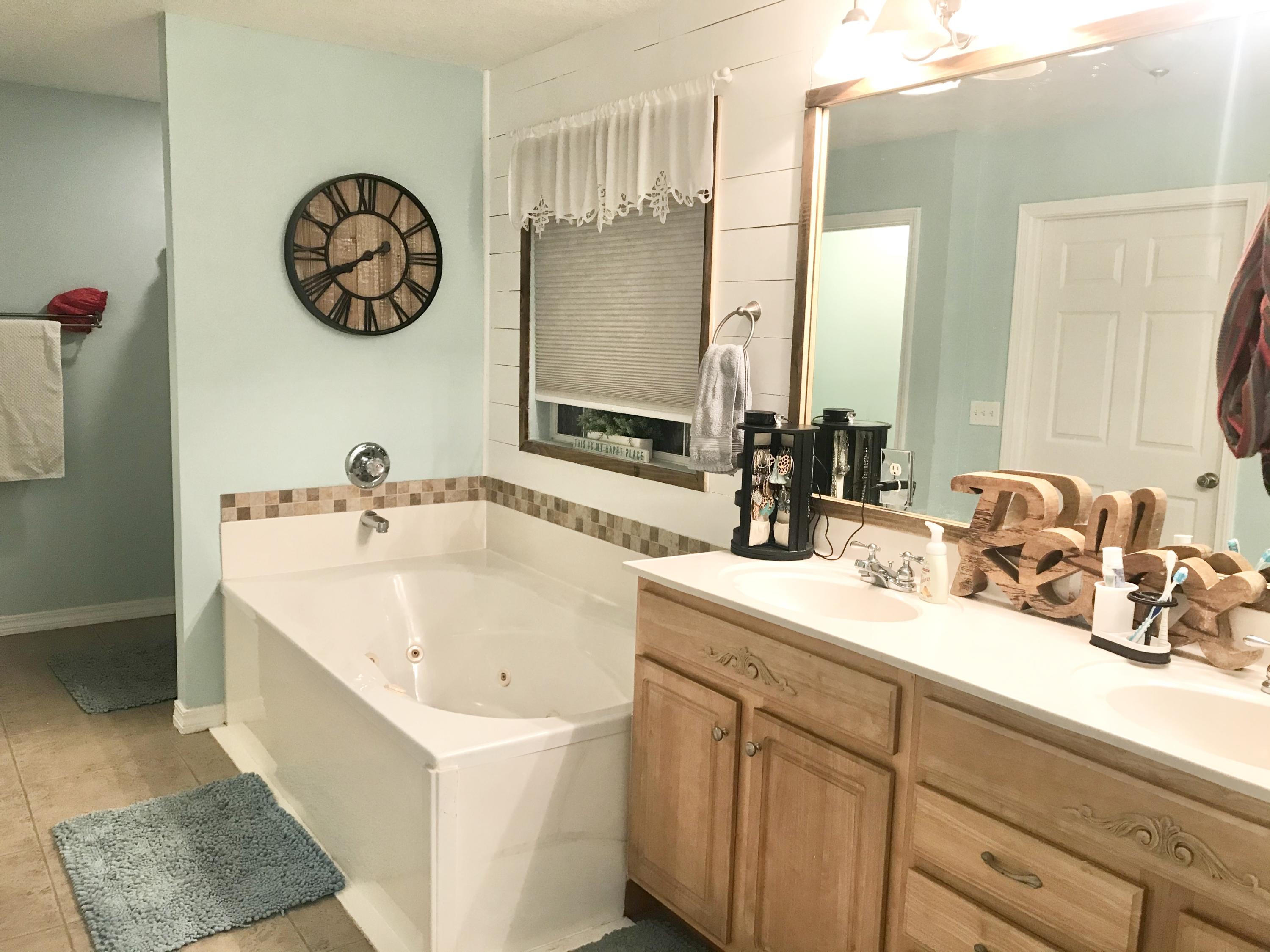 6593 Old River Road Baker, FL 32531 - Photo 19 of 23 a bathroom with a sink and a mirror