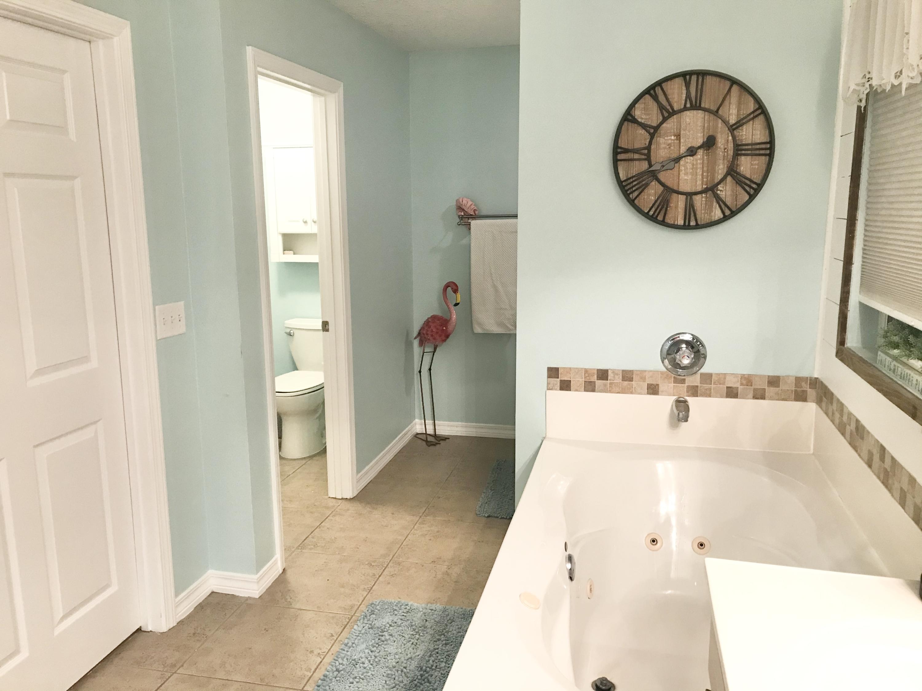 6593 Old River Road Baker, FL 32531 - Photo 20 of 23 a bathroom with a sink and a mirror