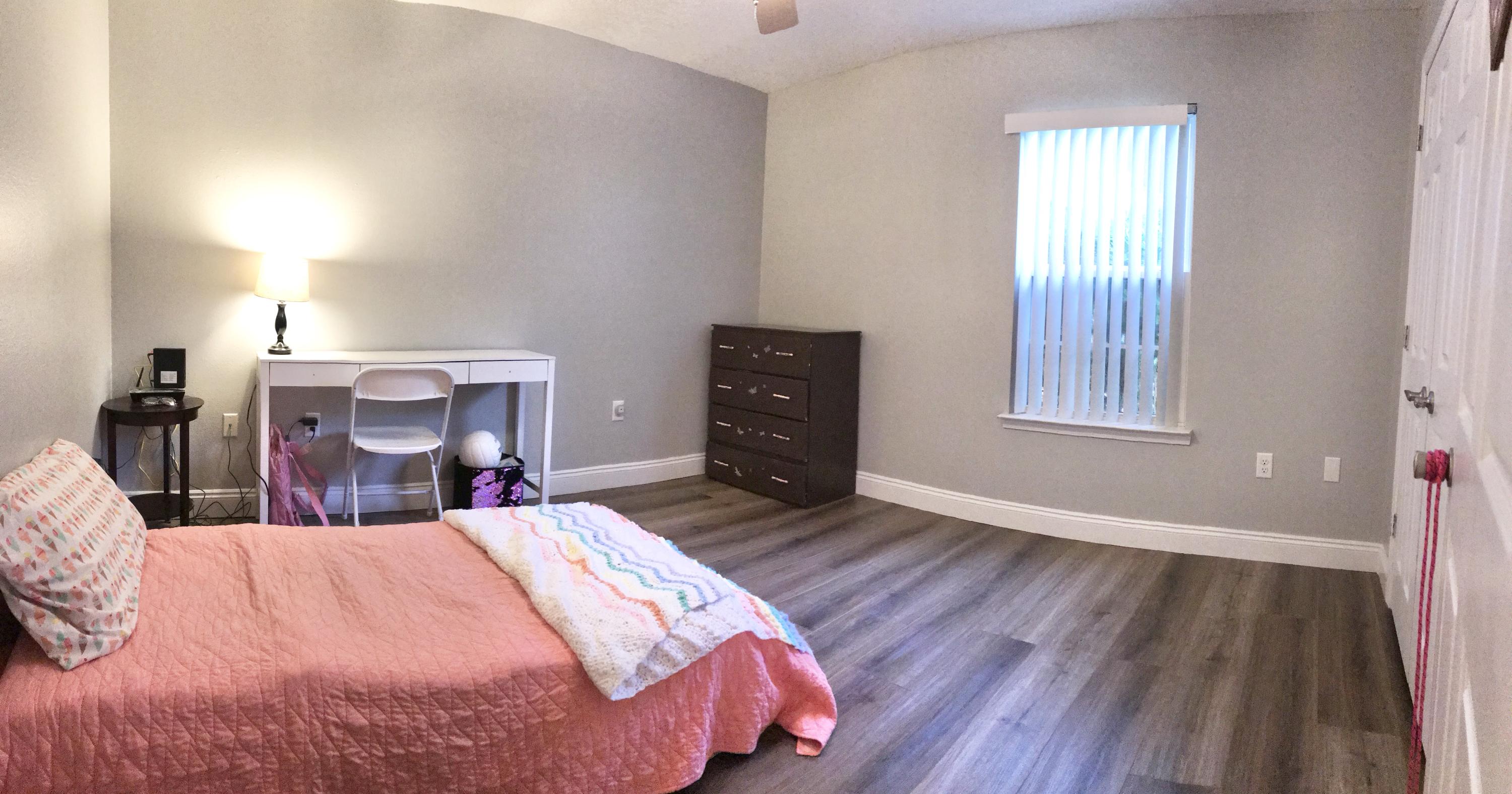 6593 Old River Road Baker, FL 32531 - Photo 2 of 23 a bed room with a bed and a window
