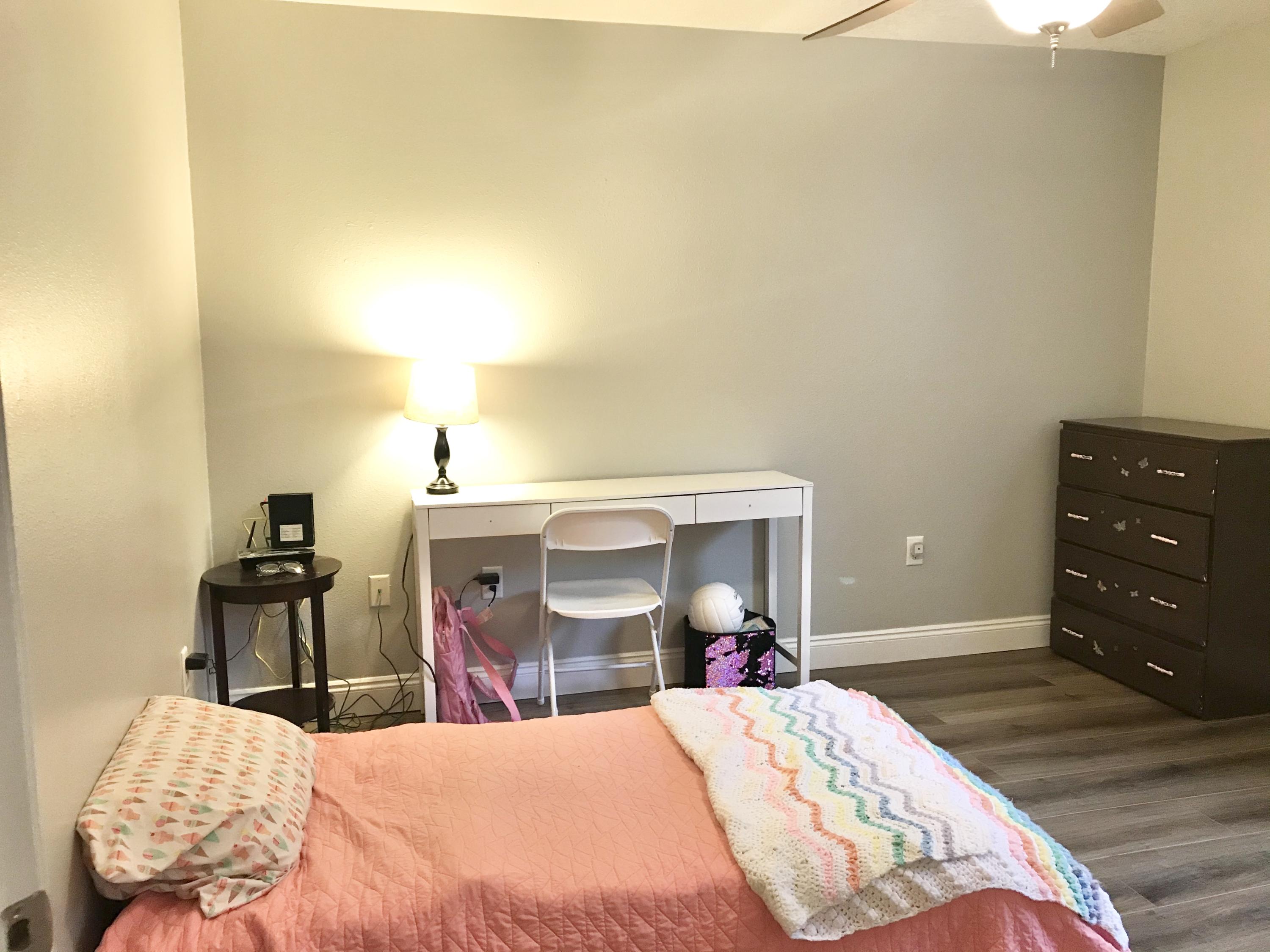 6593 Old River Road Baker, FL 32531 - Photo 3 of 23 a bedroom with a bed and a table in it