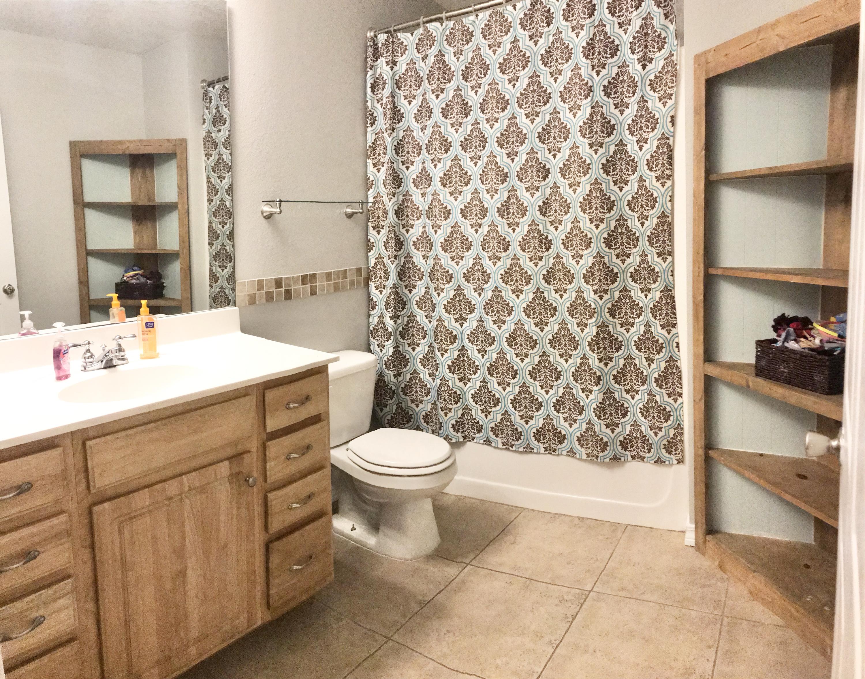 6593 Old River Road Baker, FL 32531 - Photo 8 of 23 a bathroom with a sink toilet and shower