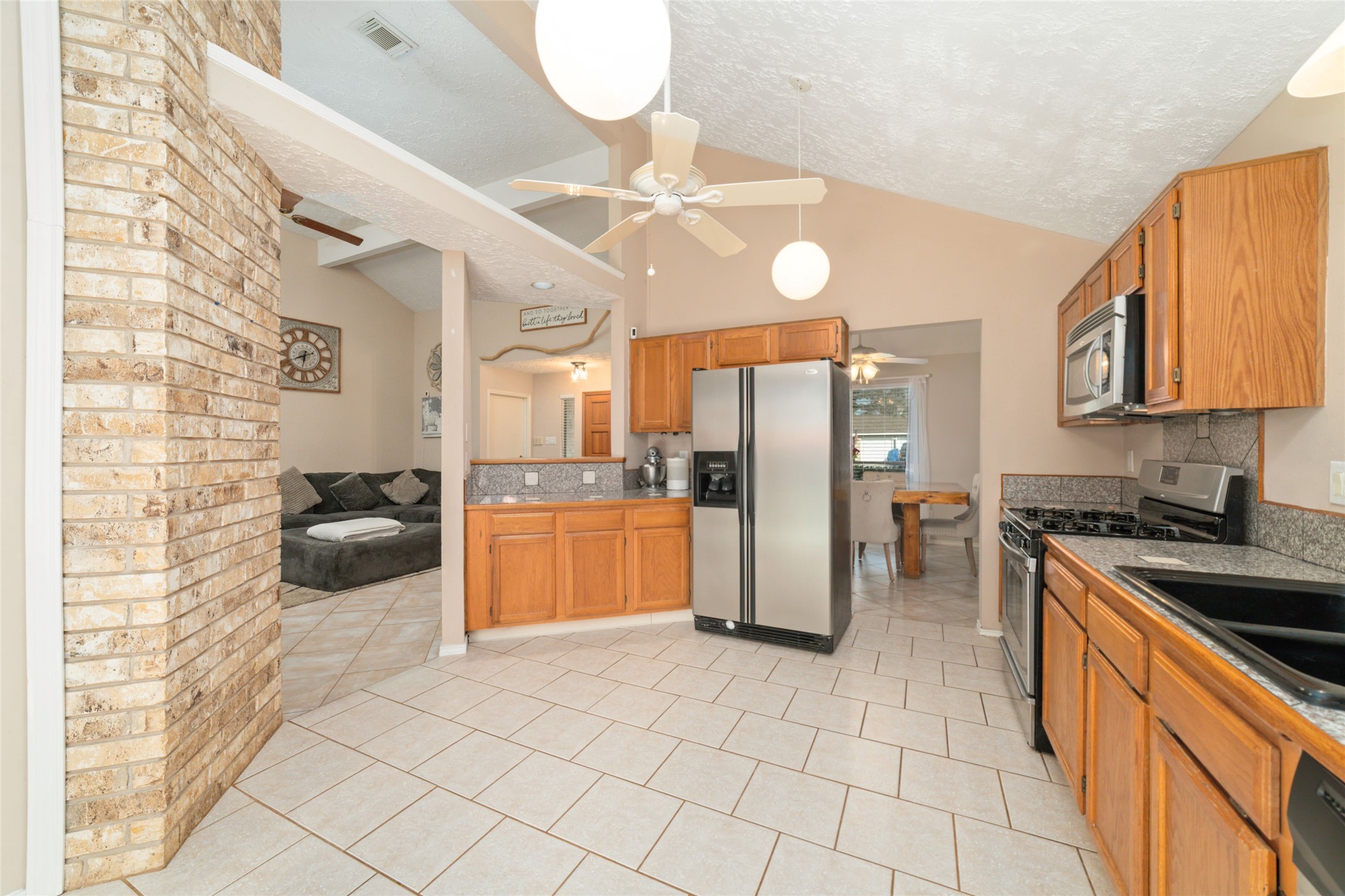 3315 Haydee Road Spring, TX 77388 - Photo 16 of 29 a kitchen with stainless steel appliances granite countertop a stove a sink and a refrigerator