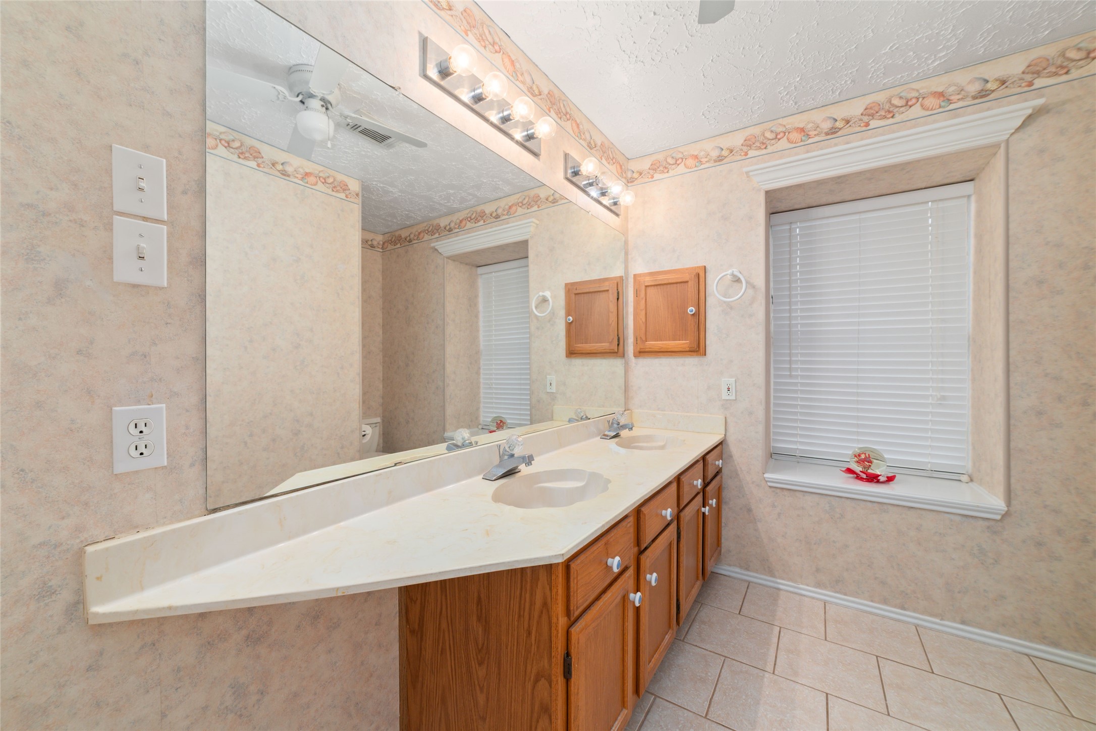 3315 Haydee Road Spring, TX 77388 - Photo 20 of 29 a bathroom with a sink and a mirror