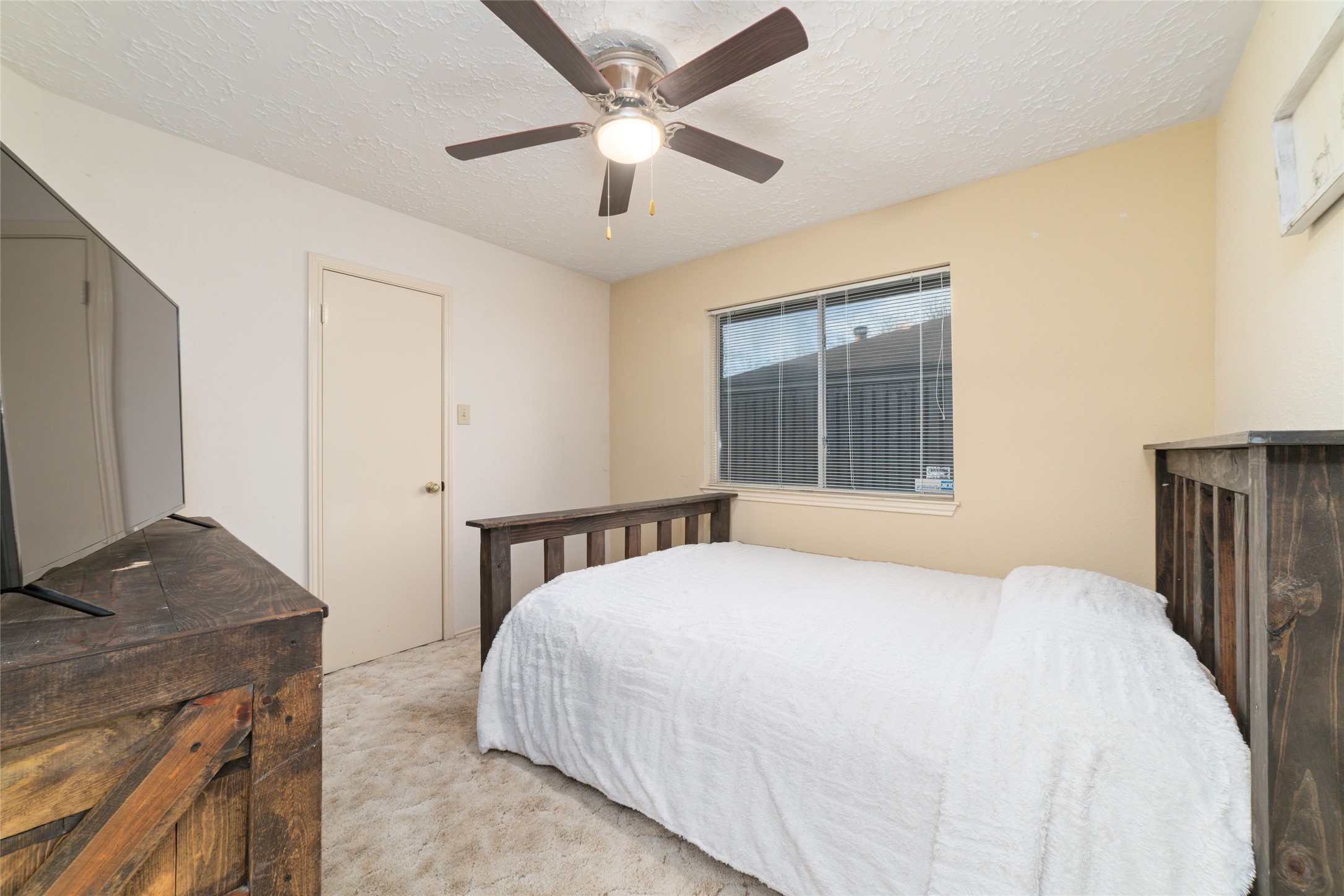 3315 Haydee Road Spring, TX 77388 - Photo 22 of 29 a bedroom with a large bed and a window