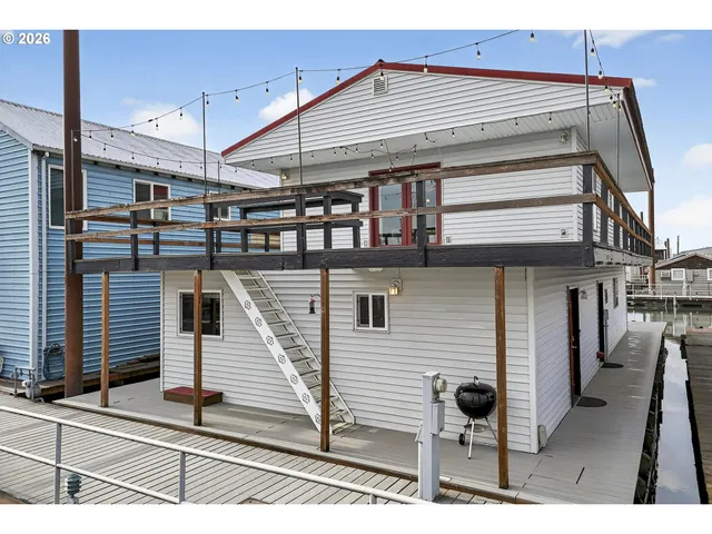 a front view of a house with wooden stairs