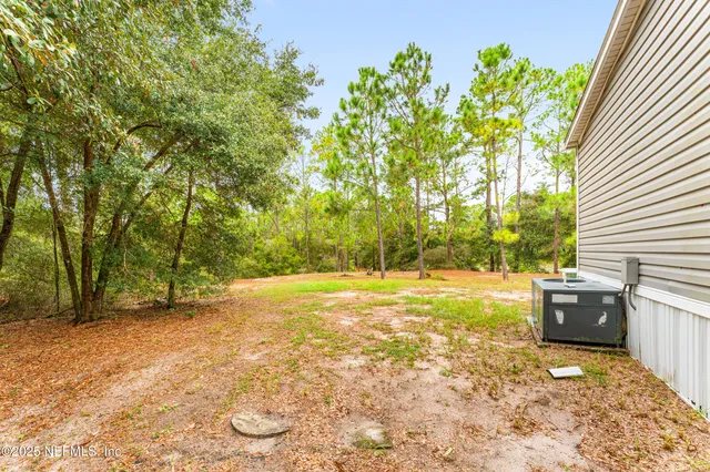 a view of back yard of the house
