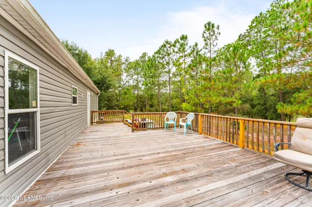 a balcony view with a seating space