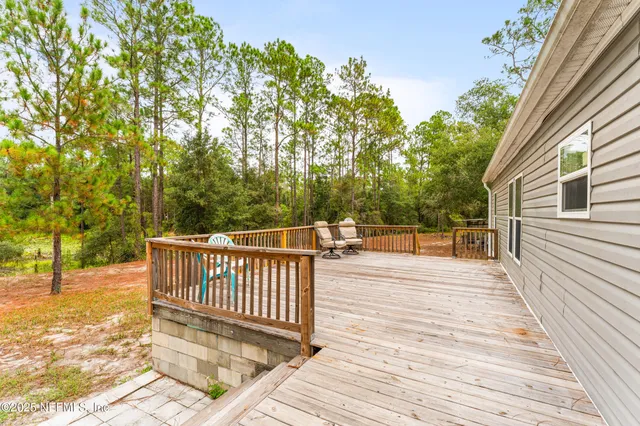 a view of a patio with wooden floor