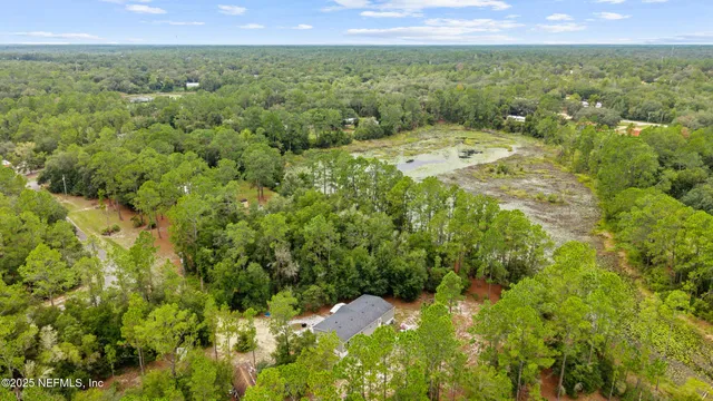 a view of a city with lush green forest